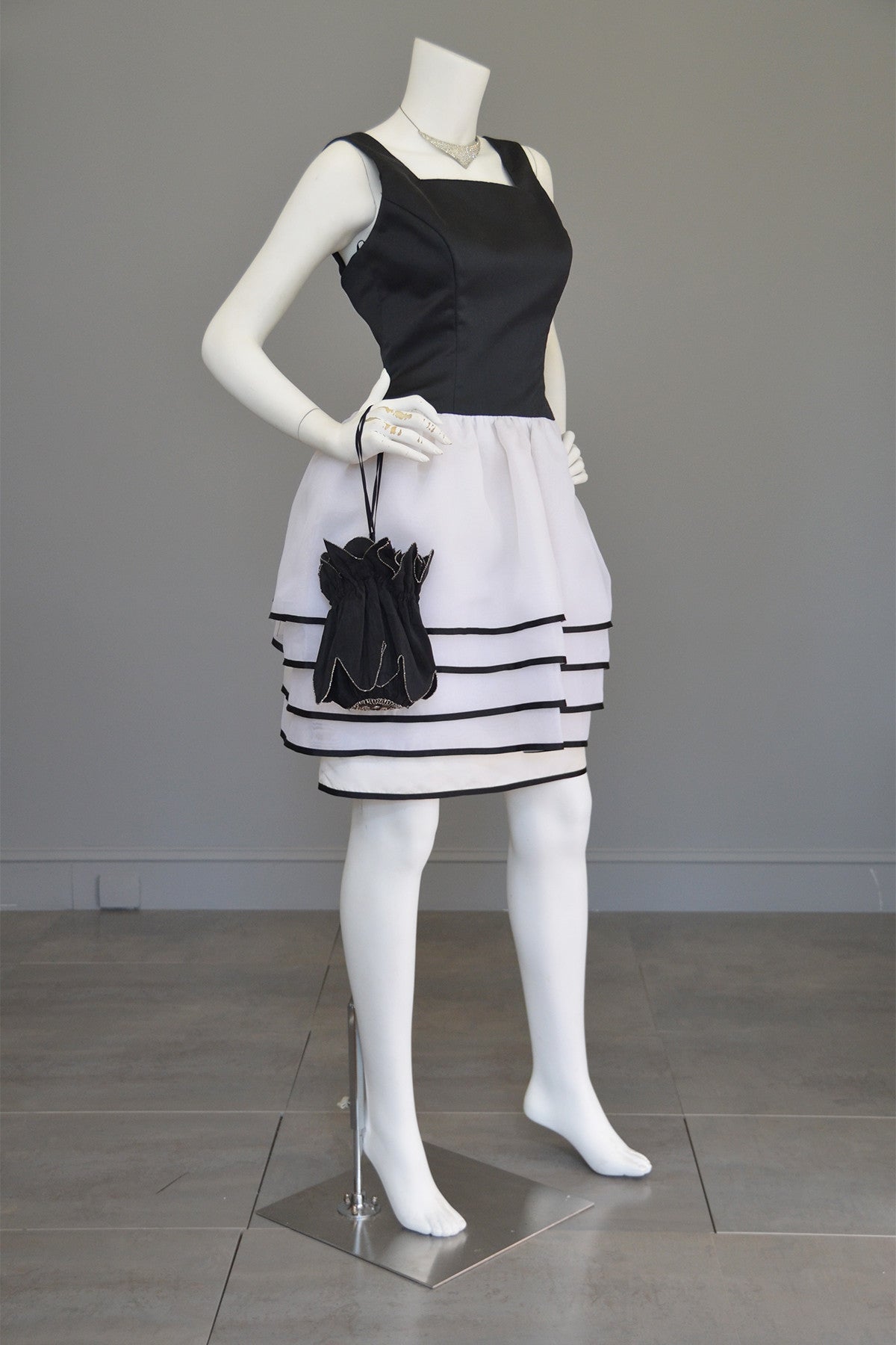 black and white peplum dress VC Elegant Black Mini Dress with Peplum and White Ruffle Accents for Upscale Casual Gatherings